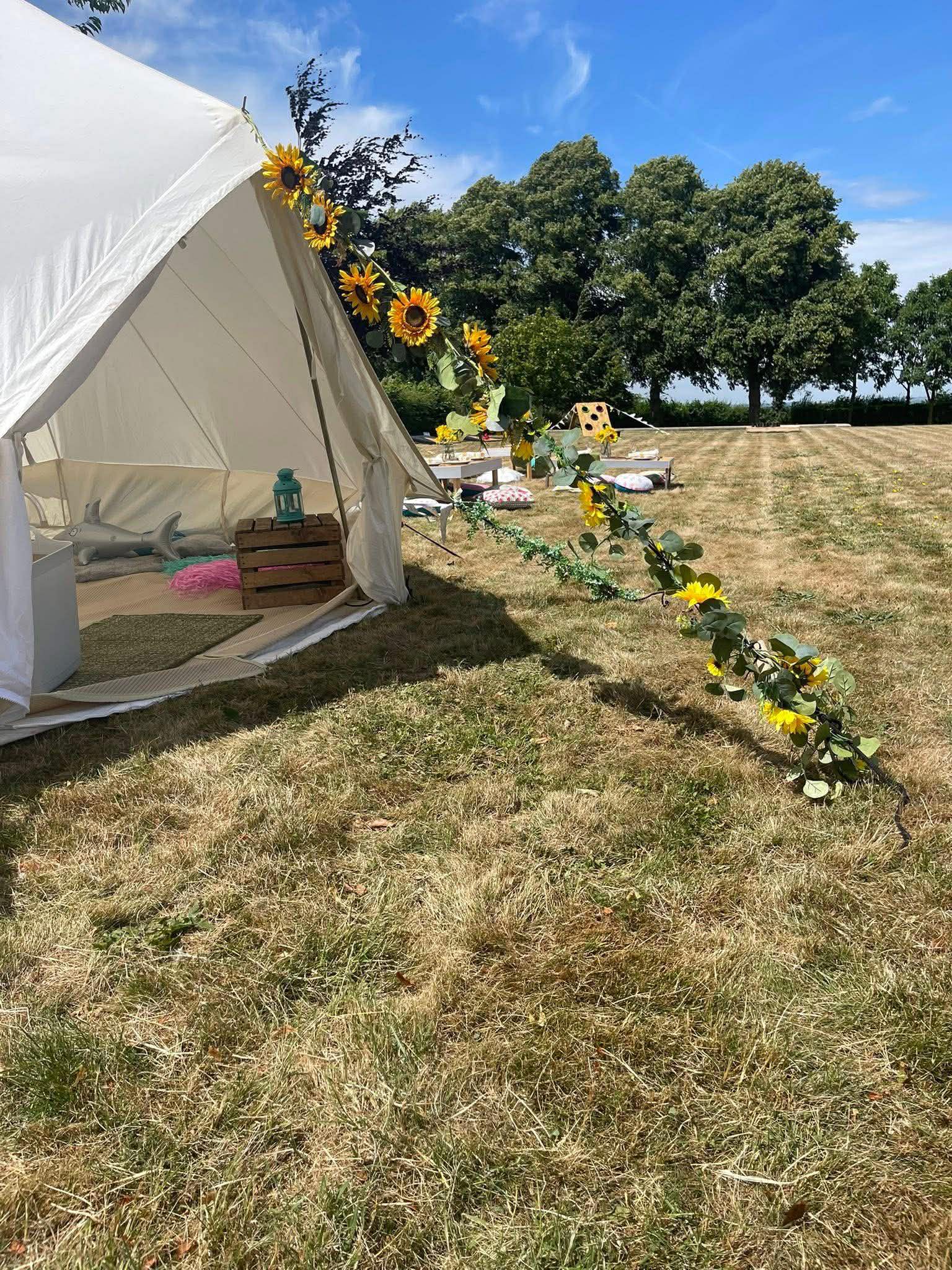 5 metre bell tent with sunflower garland
