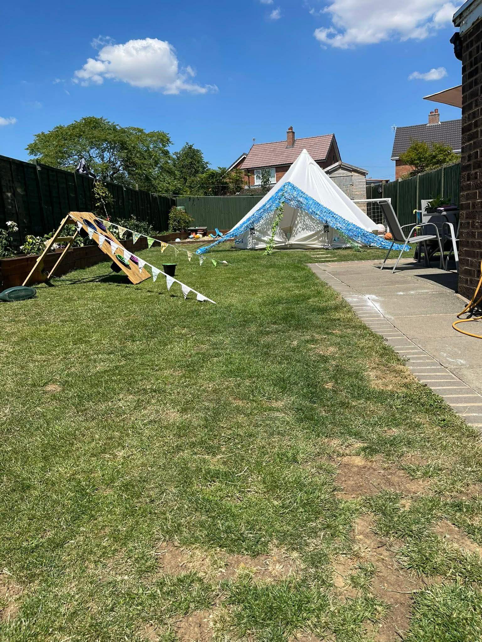 4 metre bell tent in garden with bunting