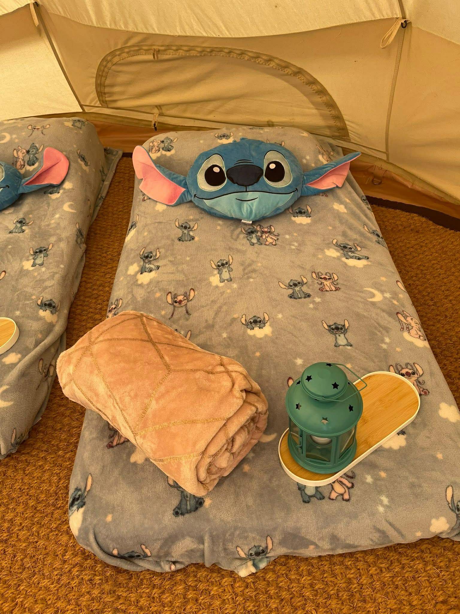 Stitch themed children's sleepover inside bell tent